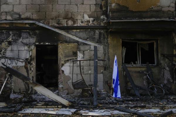 An Israeli flag is placed next to a house destroyed by Hamas militants in Kibbutz Be'eri, Israel, Sunday, Oct. 22, 2023. Picture: AP Photo/Ariel Schalit An Israeli flag is placed next to a house destroyed by Hamas militants in Kibbutz Be'eri, Israel, Sunday, Oct. 22, 2023. Picture: AP Photo/Ariel Schalit